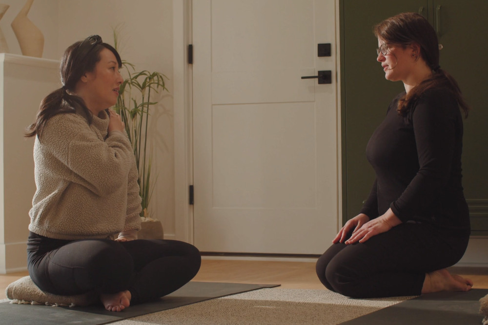 Sara working with a client in a yoga therapy session