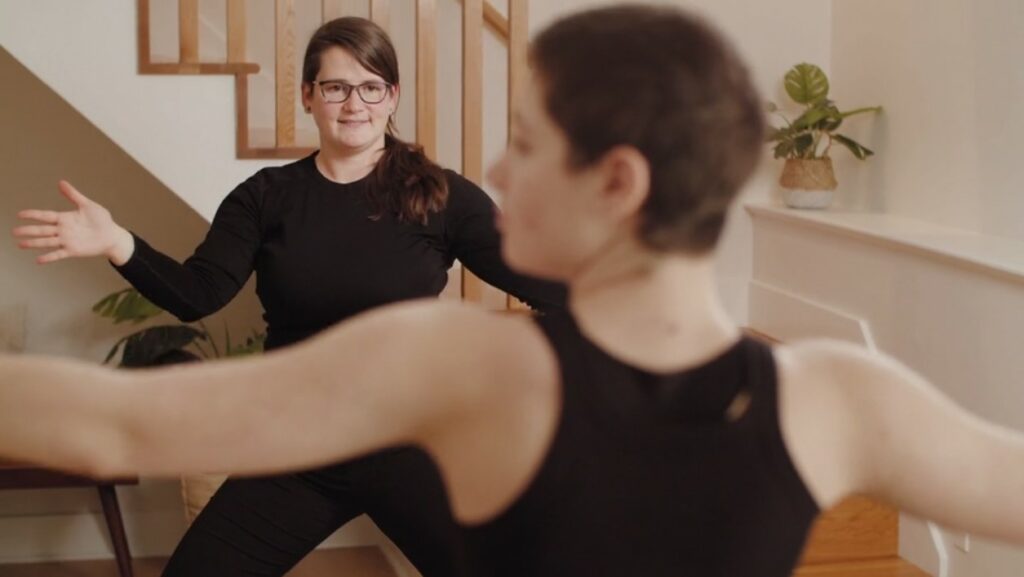 Yoga therapist Sara Merrick-Albano works with a client one-on-one to reduce chronic pain