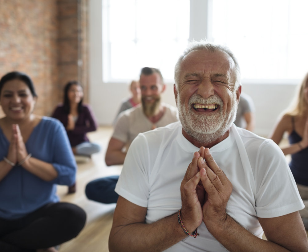 Man laughing during staff wellness retreat